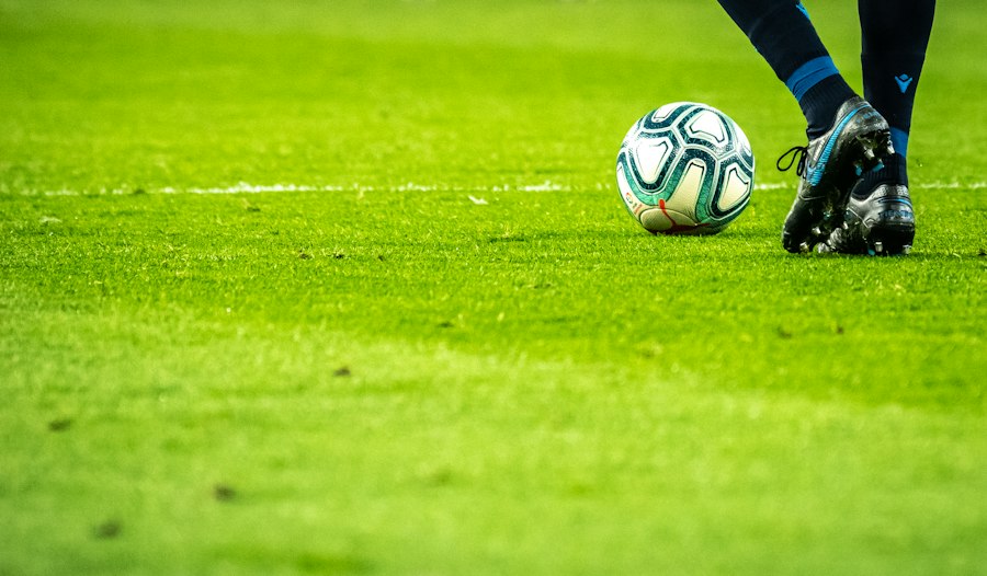 Street soccer player striking ball